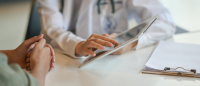 nurse holding tablet